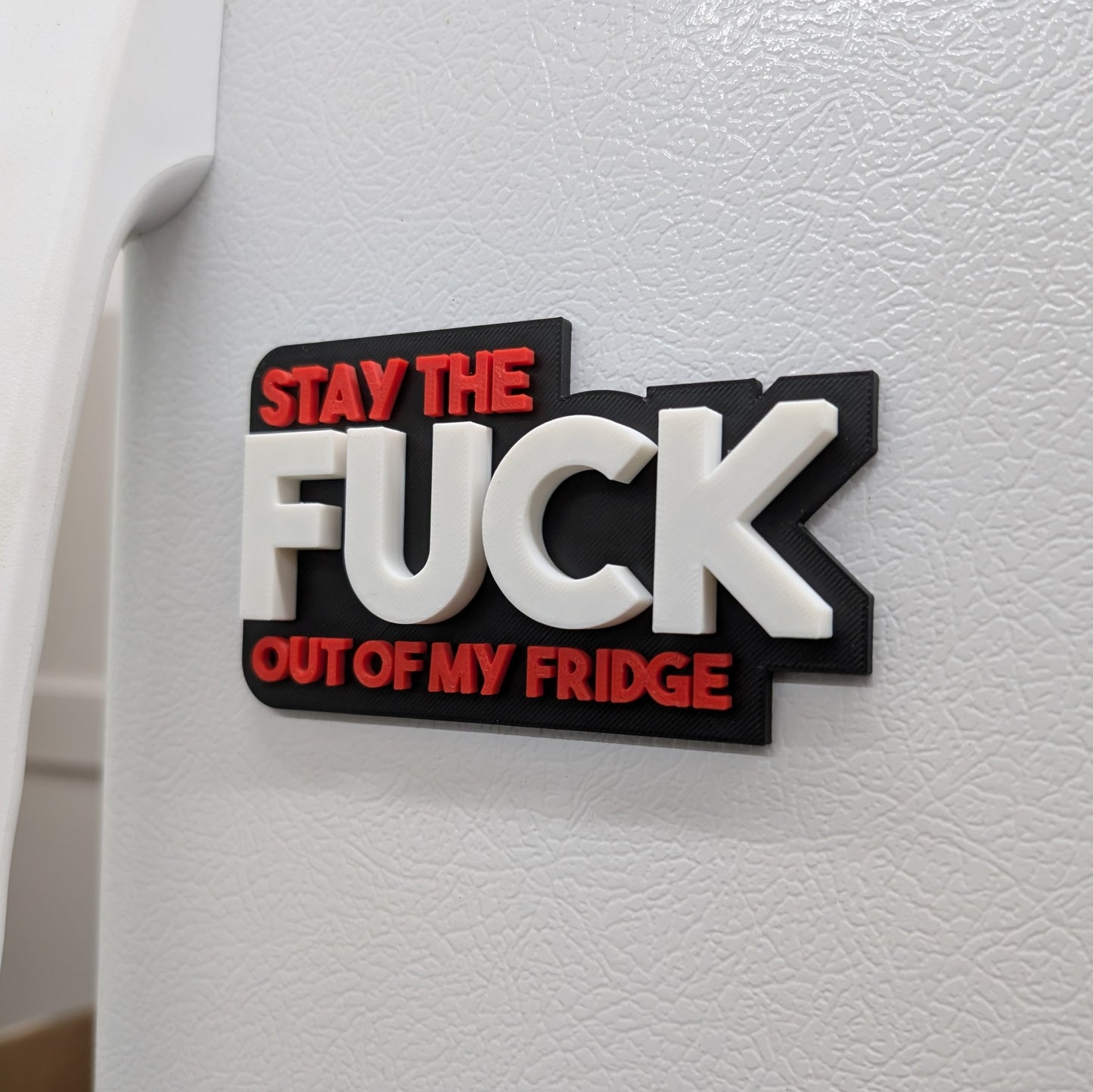 Reste en dehors de mon aimant de frigo